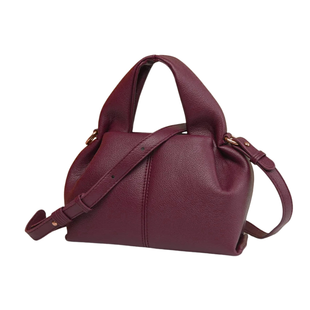 Maroon handbag with a shoulder strap on a white background